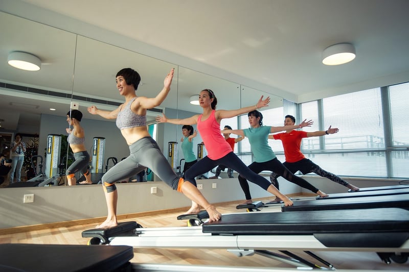 Woman practicing Reformer Pilates